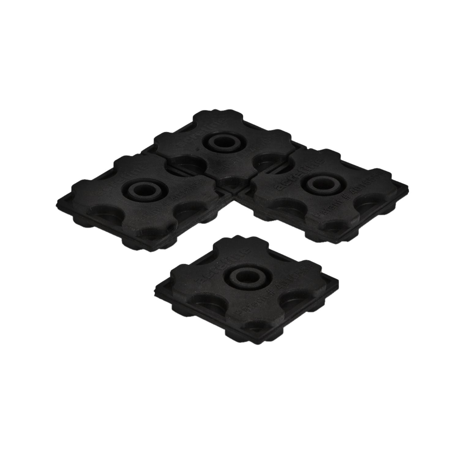 Separate Acrefine modular rubber pad isolation units demonstrating the patented interlocking puzzle connection mechanism.