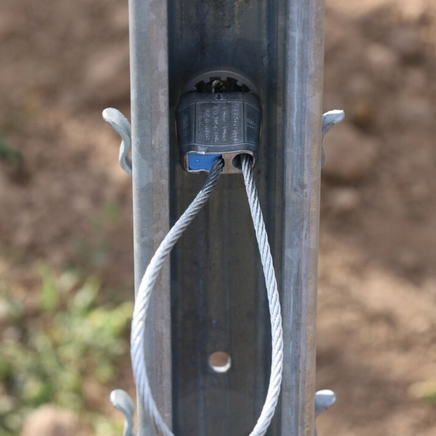Internal view of a metal post channel showcasing a Gripple GP unit seated inside for a recessed tensioning application.